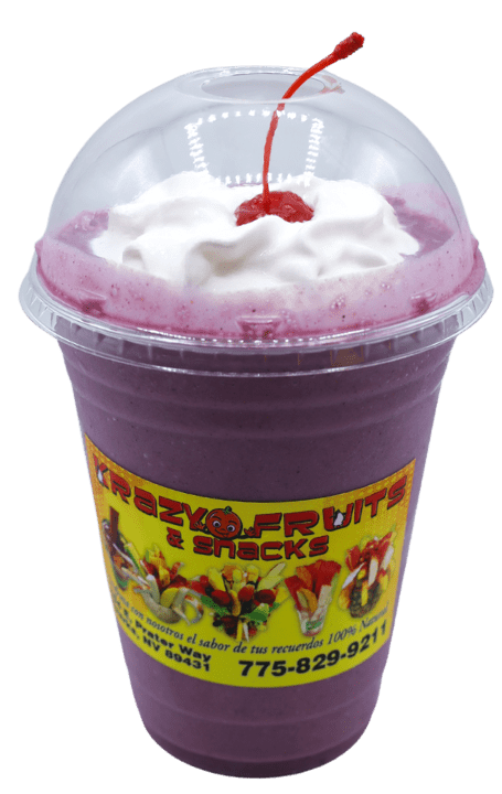 3 berries smoothie topped with whipped cream and aa cherry at Krazy Fruits.