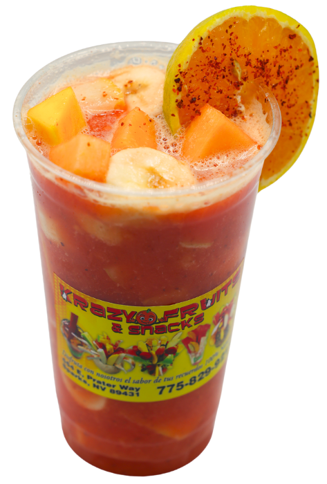 Diced mango, banana slices and topped with a slice of orange and tajin drink at Krazy Fruits.