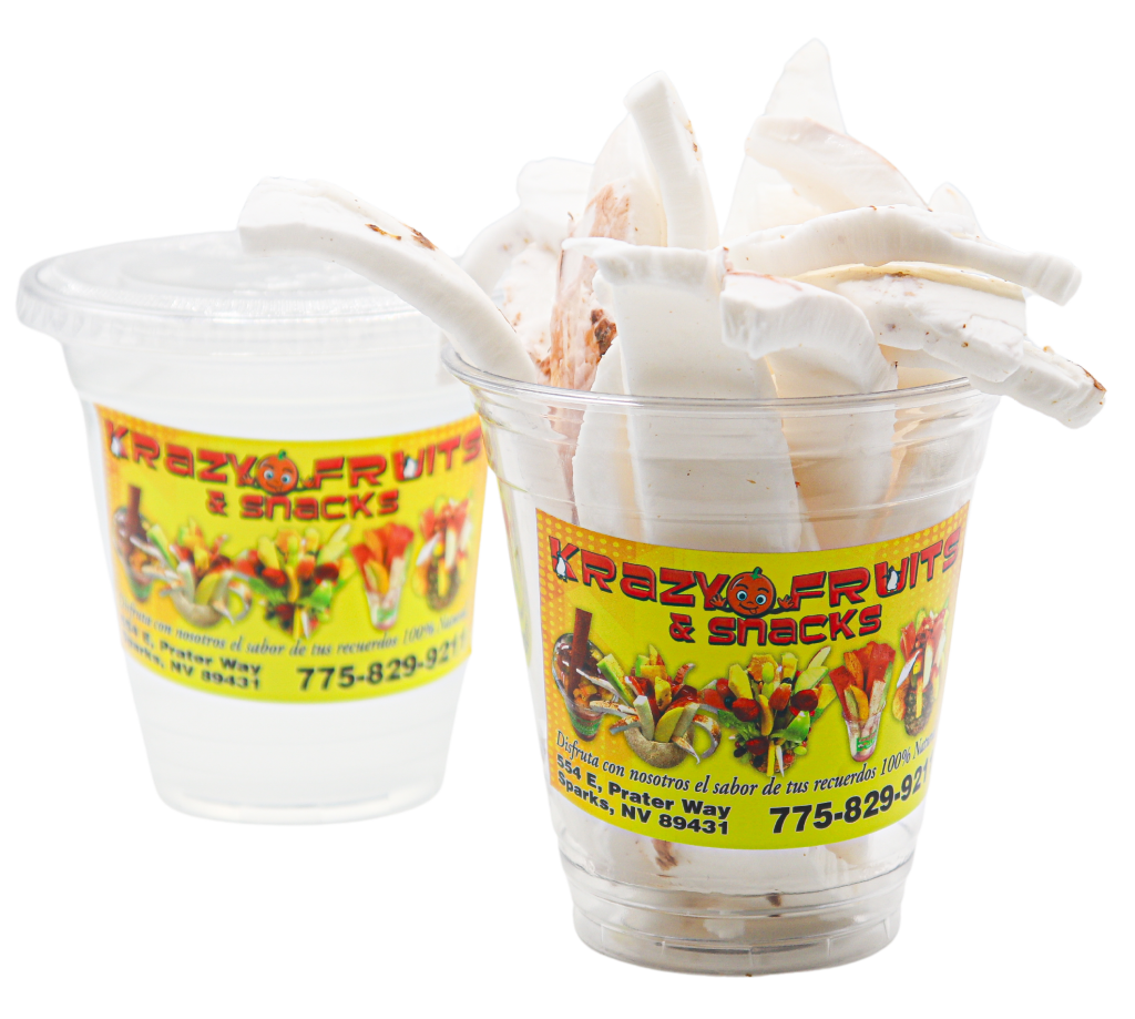 Coconut slices served in one cup and coconut water in another at Krazy Fruits.