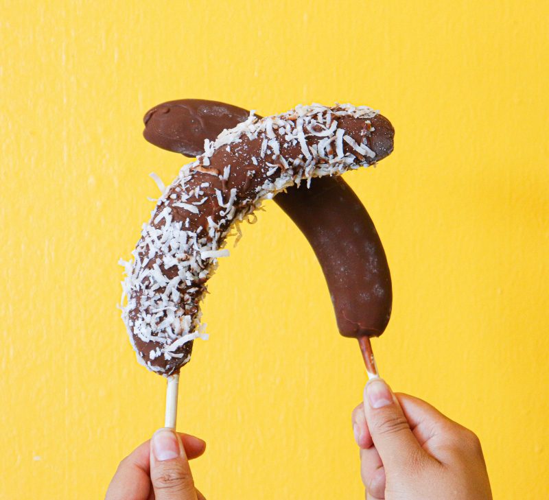 Chocolate covered bananas sprinkled coconut flakes at Krazy Fruits.
